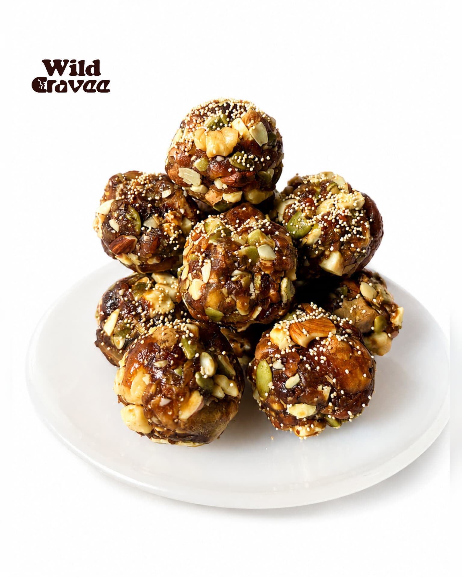 A stack of Wild Cravee dry fruit energy laddus